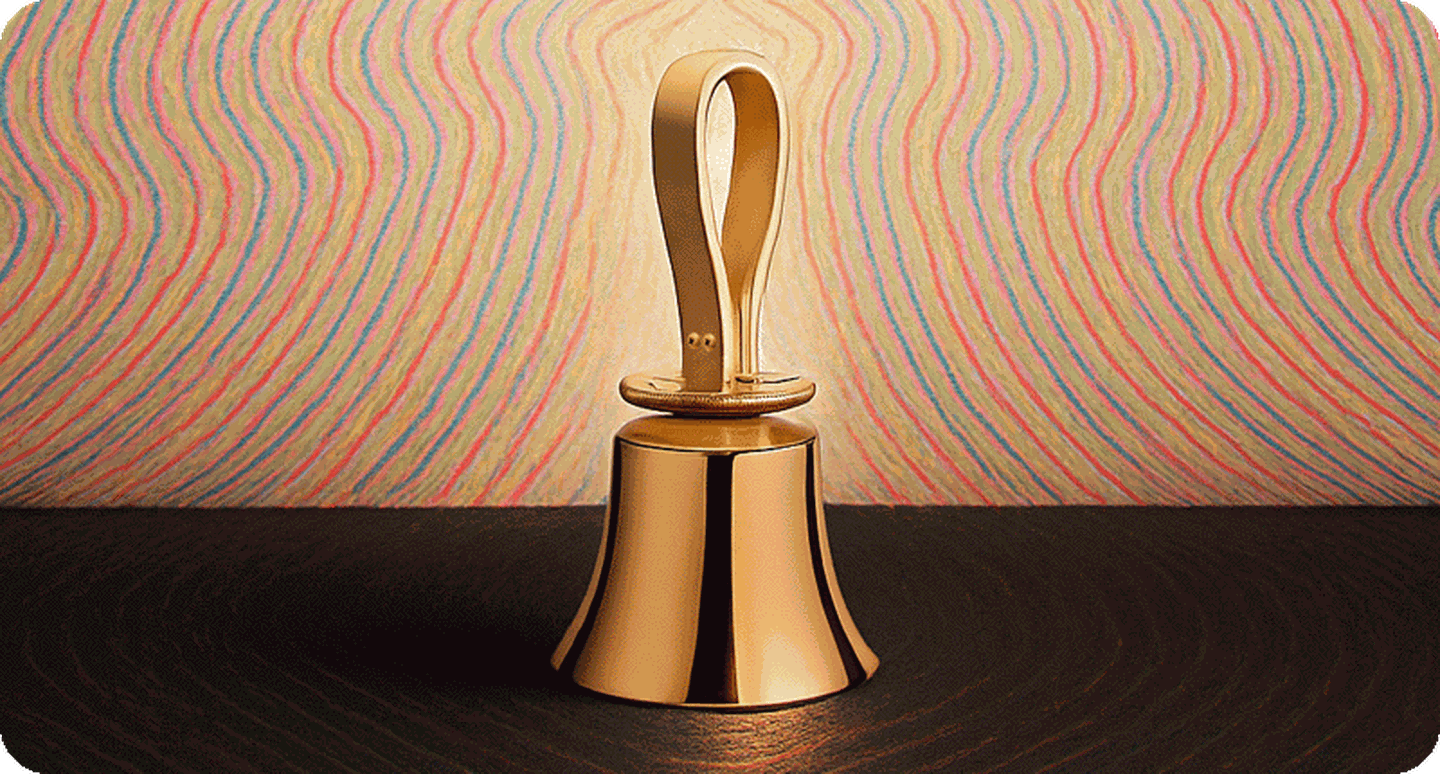Single handbell on table.